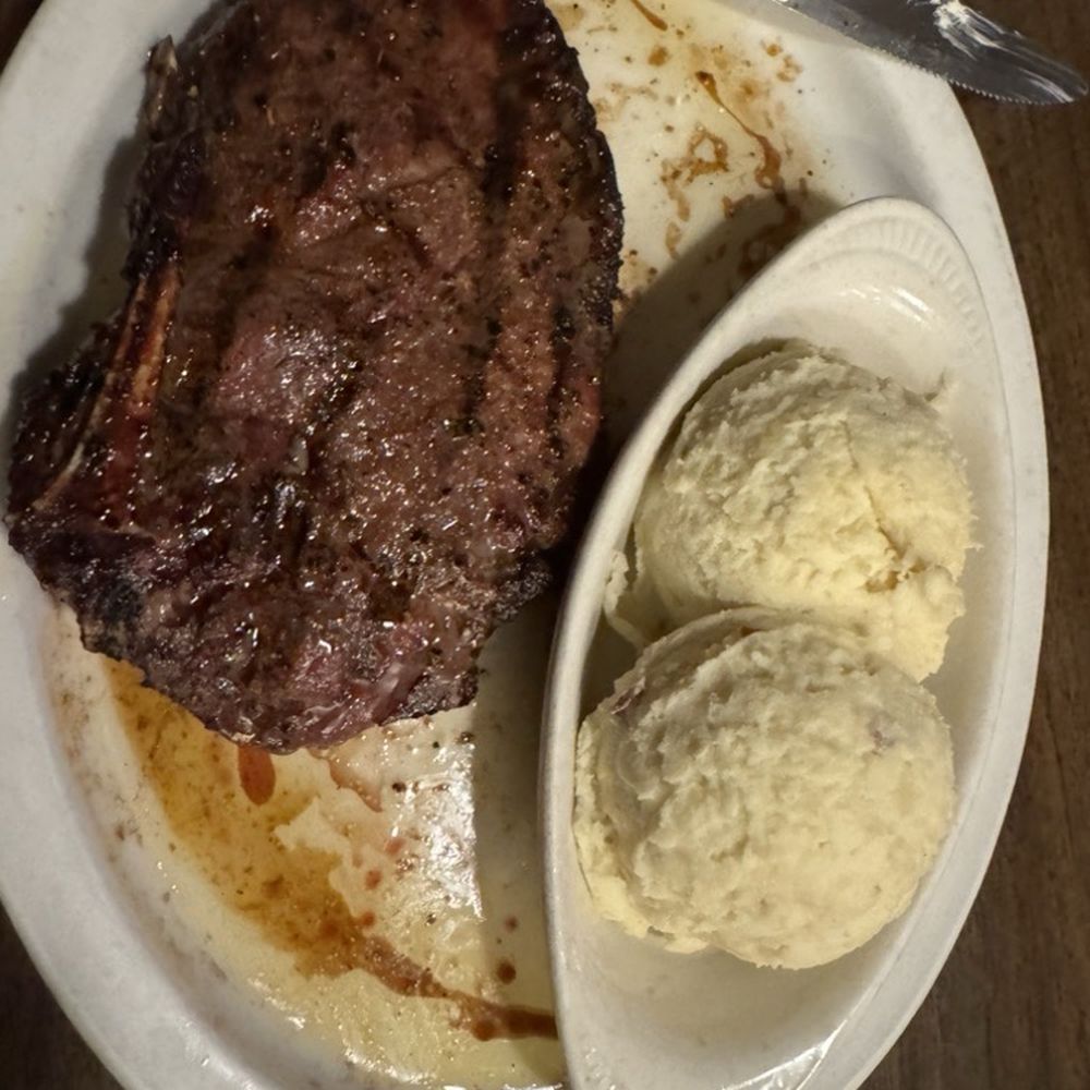 Lucky's Steak House - Ribeye Steak with mashed potatoes - Steakhouses Near Me - Fenton, Michigan