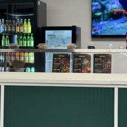 Mahogany's Jamaican Cuisine - Menu and drink station.