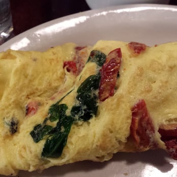 The Roost - Sundries tomato, feta, and spinach omelet - Breakfast & Brunch Near Me - Lawrence, Kansas The Roost - Sundries tomato, feta, and spinach omelet - Breakfast & Brunch Near Me - Lawrence, Kansas