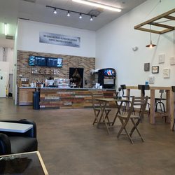 The Daily Grind Coffee Shop - Cafe counter and seating areas