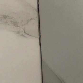 Panther Siding & Windows Inc. - Cracked grout in bathroom - General Contractors Near Me - North Bellmore, New York Panther Siding & Windows Inc. - Cracked grout in bathroom - General Contractors Near Me - North Bellmore, New York