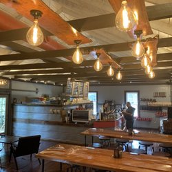 Corner Perk Port Royal - Reclaimed wood tables inside Corner Perk Port Royal
