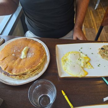 First Watch - Top pancake hiding the burnt one. Over hard eggs when asked for medium. - American Near Me - Queen Creek, Arizona First Watch - Top pancake hiding the burnt one. Over hard eggs when asked for medium. - American Near Me - Queen Creek, Arizona