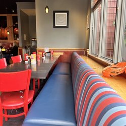 Red Robin Gourmet Burgers and Brews - Dirty table and behind shelf after cleaning