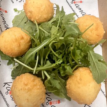 Kalamaki - Hot Meli Bites - crispy fried cheese fritters drizzled with hot thyme honey - Greek Near Me - Hauppauge, New York Kalamaki - Hot Meli Bites - crispy fried cheese fritters drizzled with hot thyme honey - Greek Near Me - Hauppauge, New York