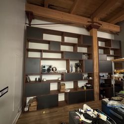 Schlep - Custom walnut book cases with integrated lighting, cabinets and drawers