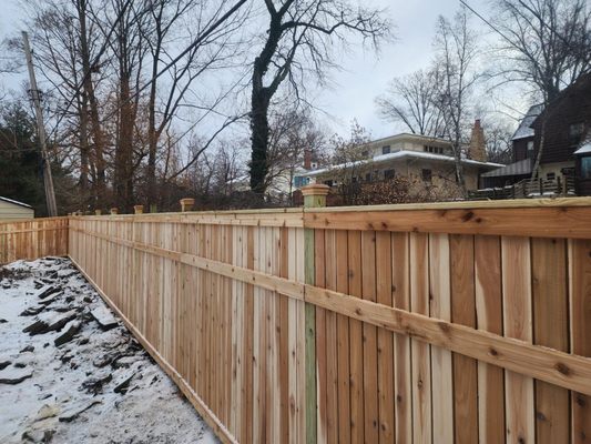 Cedar Wood Winter Install - This custom cedar wood privacy fence was installed in December 2025, demonstrating that high-quality fence installations can be completed successfully even during the winter months. The project was designed around the homeowner’s specific privacy needs and the existing architectural elements of her yard.
The customer requested a fully private fence but wanted it to visually align with an existing trellis feature already in place. Rather than adding a new trellis top—which would have reduced privacy and altered the clean look she preferred—our team designed a custom solution by raising the mid-rail height. This allowed the fence to match the trellis sightline while maintaining complete privacy throughout the yard.
At Acme Fence, we exclusively use cedar wood for our wood fence installations. Unlike pressure-treated pine, which can warp, crack, and deteriorate more quickly over time, cedar offers superior durability, natural resistance to rot and insects, and long-term performance in Northeast Ohio’s climate. The result is a fence that not only looks beautiful on day one, but is built to last for years to come.
Each section of this fence was carefully constructed and installed with attention to alignment, spacing, and structural integrity. Winter ground conditions were properly accounted for to ensure a solid, permanent installation—not a seasonal solution. From planning through completion, the project benefited from shorter winter lead times, allowing for thoughtful customization and efficient execution without the congestion of peak season schedules.
This installation reflects Acme Fence’s commitment to being Proactive in design, Communicative throughout the process, and Proud of the craftsmanship we deliver. The finished cedar privacy fence provides the homeowner with peace of mind, enhanced privacy, and a seamless visual connection to her existing outdoor features—proving that winter is an excellent time to invest in a custom-built fence. Cedar Wood Winter Install - This custom cedar wood privacy fence was installed in December 2025, demonstrating that high-quality fence installations can be completed successfully even during the winter months. The project was designed around the homeowner’s specific privacy needs and the existing architectural elements of her yard.
The customer requested a fully private fence but wanted it to visually align with an existing trellis feature already in place. Rather than adding a new trellis top—which would have reduced privacy and altered the clean look she preferred—our team designed a custom solution by raising the mid-rail height. This allowed the fence to match the trellis sightline while maintaining complete privacy throughout the yard.
At Acme Fence, we exclusively use cedar wood for our wood fence installations. Unlike pressure-treated pine, which can warp, crack, and deteriorate more quickly over time, cedar offers superior durability, natural resistance to rot and insects, and long-term performance in Northeast Ohio’s climate. The result is a fence that not only looks beautiful on day one, but is built to last for years to come.
Each section of this fence was carefully constructed and installed with attention to alignment, spacing, and structural integrity. Winter ground conditions were properly accounted for to ensure a solid, permanent installation—not a seasonal solution. From planning through completion, the project benefited from shorter winter lead times, allowing for thoughtful customization and efficient execution without the congestion of peak season schedules.
This installation reflects Acme Fence’s commitment to being Proactive in design, Communicative throughout the process, and Proud of the craftsmanship we deliver. The finished cedar privacy fence provides the homeowner with peace of mind, enhanced privacy, and a seamless visual connection to her existing outdoor features—proving that winter is an excellent time to invest in a custom-built fence.