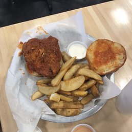 a fried chicken sandwich and french fries a fried chicken sandwich and french fries