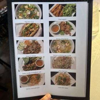 Cafe Da Lat - A menu board featuring images and names of Vietnamese dishes such as veggie tofu soup, Vietnamese sandwich, and lotus stem salad. - Vietnamese Near Me - Albuquerque, New Mexico