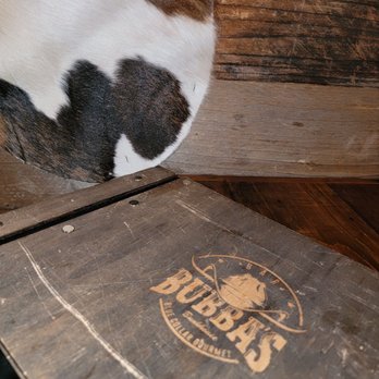 Bubba's Bunkhouse - a cow sleeping on a crate - Sandwiches Near Me - Harrisburg, North Carolina
