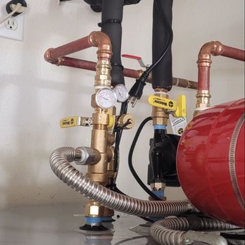 Eclipse Solar Services - Valves, thermometers, pump, drains, mixer and expansion tank on top of the water heater. - Solar Installation Near Me Eclipse Solar Services - Valves, thermometers, pump, drains, mixer and expansion tank on top of the water heater. - Solar Installation Near Me