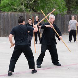 Authentic Kung Fu - Sifu Cottrell and a student demonstrates staff.