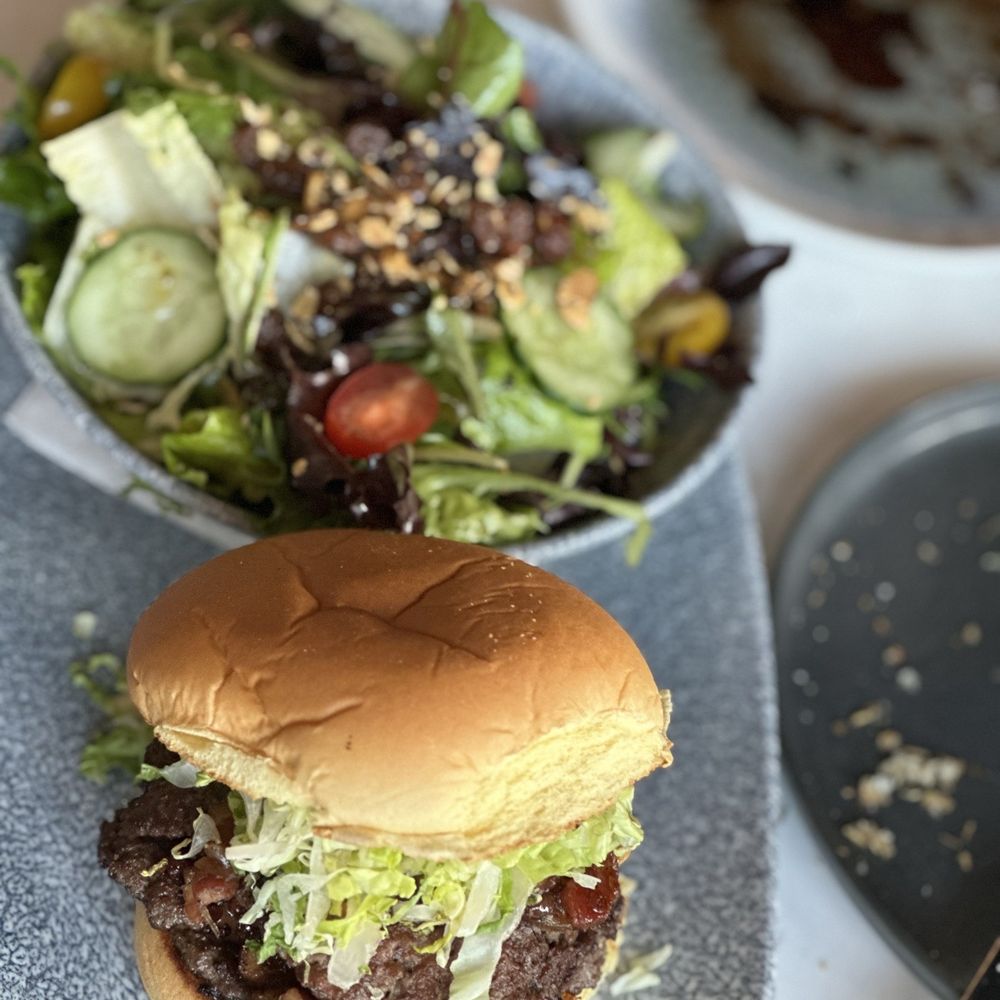 The Table Bistro - Bacon onion jam burger, and salad - Bistros Near Me - Abbotsford, British Columbia The Table Bistro - Bacon onion jam burger, and salad - Bistros Near Me - Abbotsford, British Columbia
