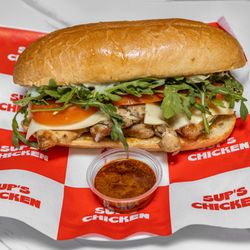 Sup's Chicken - GRILLED SANDWICH - GRILLED CHICKEN, ARUGULA, CHEESE, TOMATO WITH SUP'S MAYO. SIGNATURE HOT SAUCE ON THE SIDE