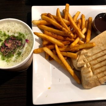 Nosh Cafe - a plate of food including a sandwich and french fries - Indian Near Me - Edmonton, Alberta Nosh Cafe - a plate of food including a sandwich and french fries - Indian Near Me - Edmonton, Alberta