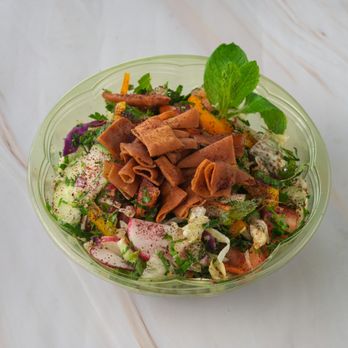 Saraya Bites - Lettuce, tomato, cucumber, radish, crispy pita chips, lemon, and olive oil. - Mediterranean Near Me - Houston, Texas Saraya Bites - Lettuce, tomato, cucumber, radish, crispy pita chips, lemon, and olive oil. - Mediterranean Near Me - Houston, Texas