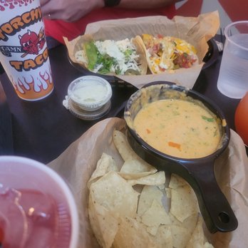 Torchy's Tacos - Queso, trailer park taco and another taco (not sure which one from the menu) - Tacos Near Me - San Antonio, Texas Torchy's Tacos - Queso, trailer park taco and another taco (not sure which one from the menu) - Tacos Near Me - San Antonio, Texas