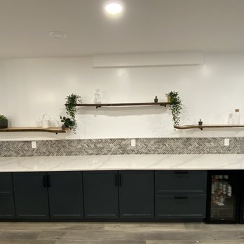Modern Innovations - a kitchen with a marble countertop - General Contractors Near Me