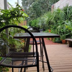 Maas coffee roasters - Back patio garden with chairs
