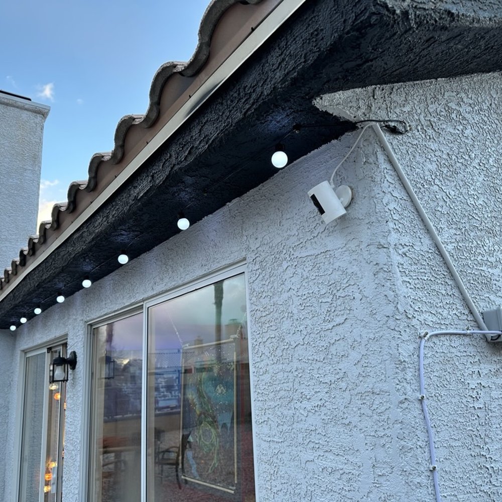 Papa Bear's Home Services - Ben wired these string lights and outdoor camera for the yard. Notice the clean wiring hidden on the side of house. - Handyman Near Me