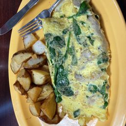 Spinach and mushroom 4 egg omelette with American fries.
