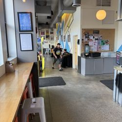 Roxy's Arcade - Tables to seat at and high tops looking out window for seating