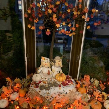 Coffee Express - a display of fall decorations in a window sill - Coffee & Tea Near Me - Port Clinton, Ohio