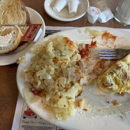 Bacon and American cheese omelet (under cooked bacon) "well done" home fries with onions and cold toast that the butter didn't even melt.