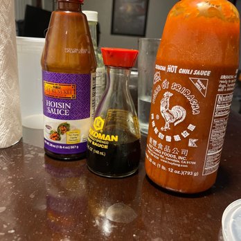 Pho Tai - two bottles of hot sauce and a bottle of hot sauce - Vietnamese Near Me - Hayward, California Pho Tai - two bottles of hot sauce and a bottle of hot sauce - Vietnamese Near Me - Hayward, California