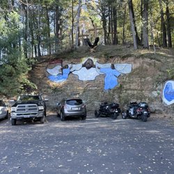 Lost Canyon Tours - Parking lot with some art.