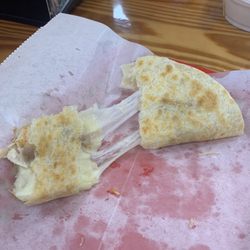 Taco Mel - Ooey-Gooey Cheese-pull from the Chicken Quesadilla.