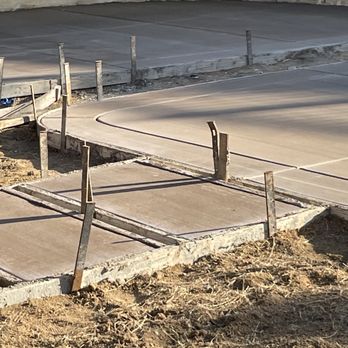 JC & Sons Landscaping - Concrete pad for fire pit - Landscaping Near Me
