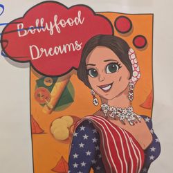 Surya Veg N Dosa - White lady cosplaying in a flag themed Sari, I guess?