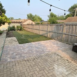 Extended the patio pavers in the outdoor dining area, removed old grass re-graded and installed new sod.