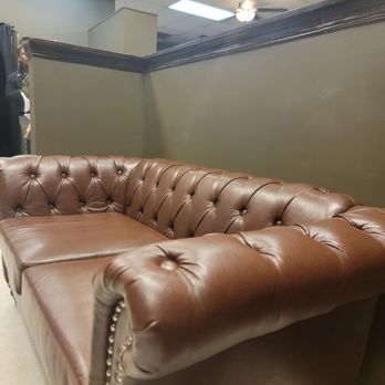 Yummys - a brown leather couch in a room - Burgers Near Me - Farmville, Virginia Yummys - a brown leather couch in a room - Burgers Near Me - Farmville, Virginia