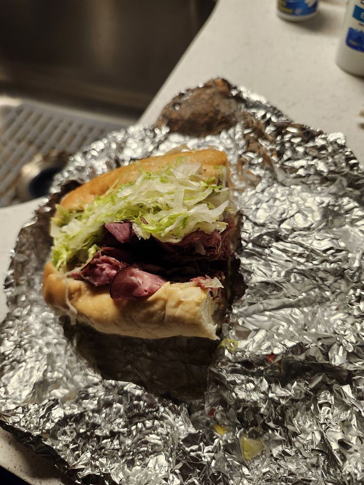 Denaro's Submarine Sandwiches Logo