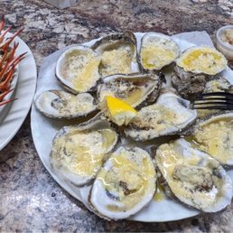 a plate of oysters and a plate of crab legs a plate of oysters and a plate of crab legs