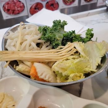 Mokkoji Shabu Shabu - Bowl of veggies, tofu, and udon noods. The veg weren't great this visit - brown and wilting. Asked for a replacement bowl. - Hot Pot Near Me - Cypress, California