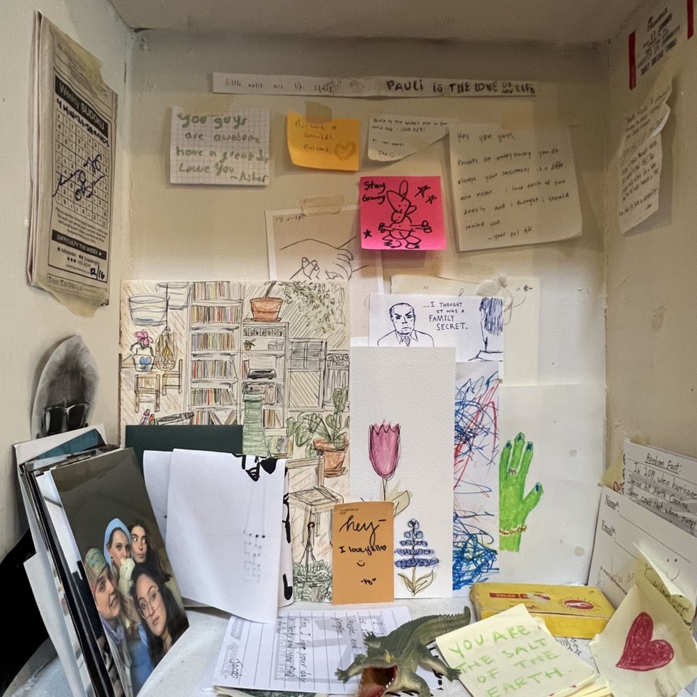 a shelf with notes, notes, and pictures a shelf with notes, notes, and pictures
