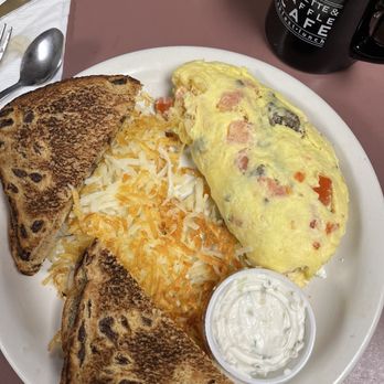 Omelette & Waffle Cafe - Greek omelette, hash browns, cinnamon raisin toast and tsatki (sp.)sauce - Breakfast & Brunch Near Me - Plymouth, Michigan Omelette & Waffle Cafe - Greek omelette, hash browns, cinnamon raisin toast and tsatki (sp.)sauce - Breakfast & Brunch Near Me - Plymouth, Michigan