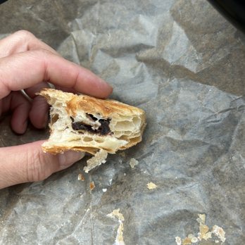 Pots And Pies - The last of a very flaky and tasty chocolate croissant. Dusted with powdered sugar - Bakeries Near Me - Crystal Lake, Illinois Pots And Pies - The last of a very flaky and tasty chocolate croissant. Dusted with powdered sugar - Bakeries Near Me - Crystal Lake, Illinois