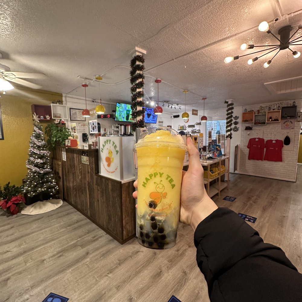 Happy Tea - a person holding a cup of tea - Bubble Tea Near Me - Corpus Christi, Texas