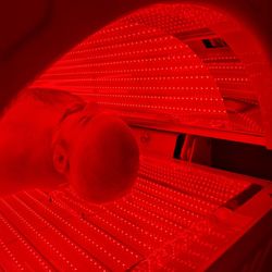 Beam Light Lounge - A client in our red light therapy bed.