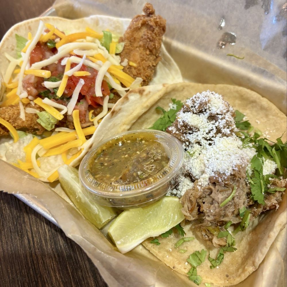 Torchy's Tacos - Trailer Park taco and green chili pork taco - Tex-Mex Near Me - Fishers, Indiana Torchy's Tacos - Trailer Park taco and green chili pork taco - Tex-Mex Near Me - Fishers, Indiana