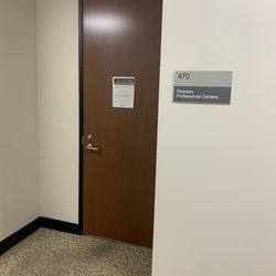 Down the hall (right side) after leaving the elevator