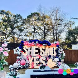 Atirela - Proposal, she said yes! 
Lit up marquee rentals 
The woodland balloons
The woodlands backdrop and more...