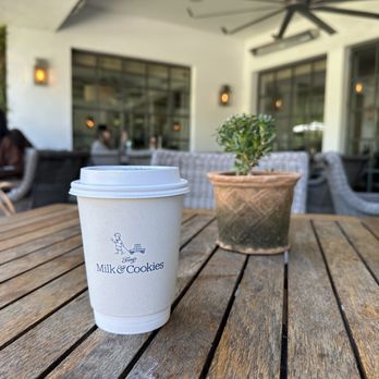 Tinys No 5 - a cup of coffee on a table - New American Near Me - West University Place, Texas Tinys No 5 - a cup of coffee on a table - New American Near Me - West University Place, Texas