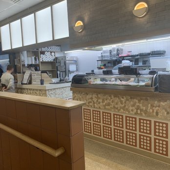 Sushi Ten - a restaurant counter with a man working behind it - Japanese Near Me - Columbus, Ohio Sushi Ten - a restaurant counter with a man working behind it - Japanese Near Me - Columbus, Ohio