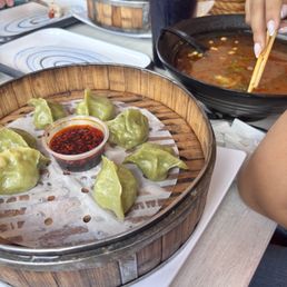 Vegetable steamed dumplings and spicy noodle soup Vegetable steamed dumplings and spicy noodle soup