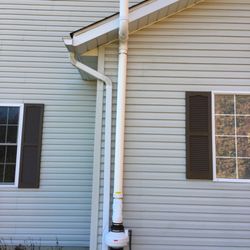 Out Radon - Out Radon installed complete radon mitigation system outside of a house in Westerville, Ohio.